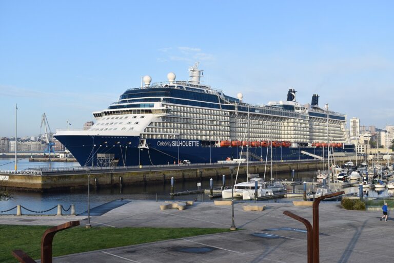 Celebrity Silhouette cruise ship with a navy blue hull docked under a clear blue sky at A Coruna, Spain