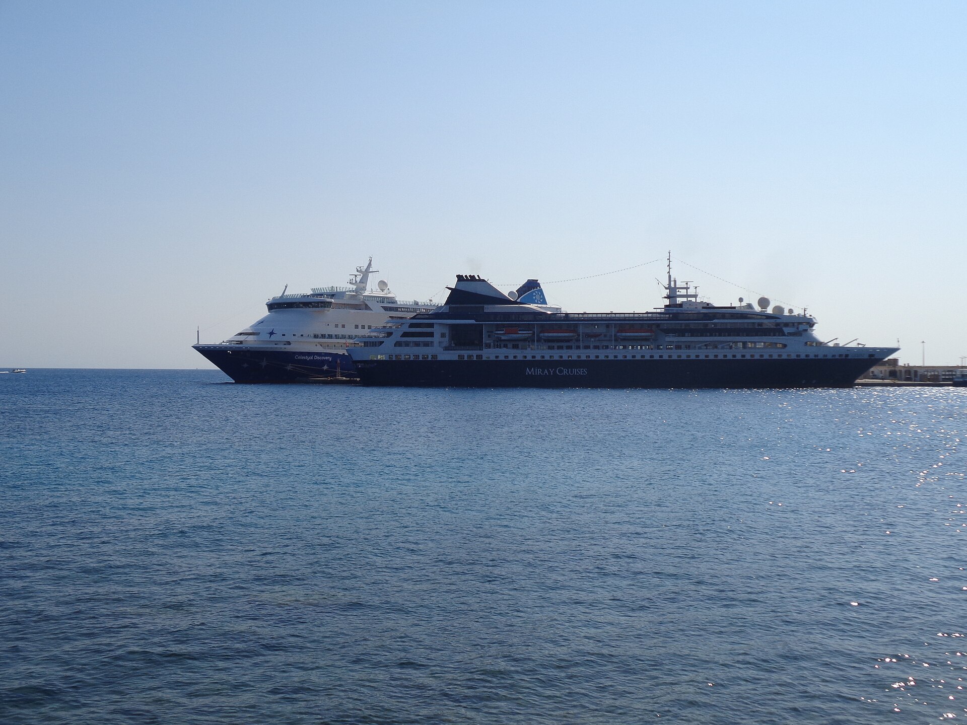 Celestyal Discovery, the former AIDAaura, moored beside Miray's Gemini in the port of Rhodes