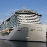Costa Smeralda cruise ship moored bow-on at the port of Savona under a blue sky