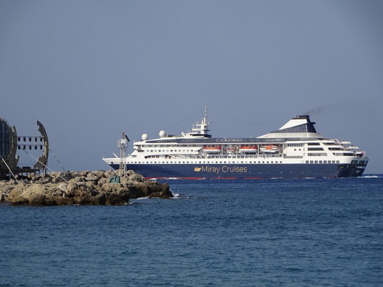 The cruise ship Gemini in Miray Cruises livery sailing out of Rhodes across a deep blue sea