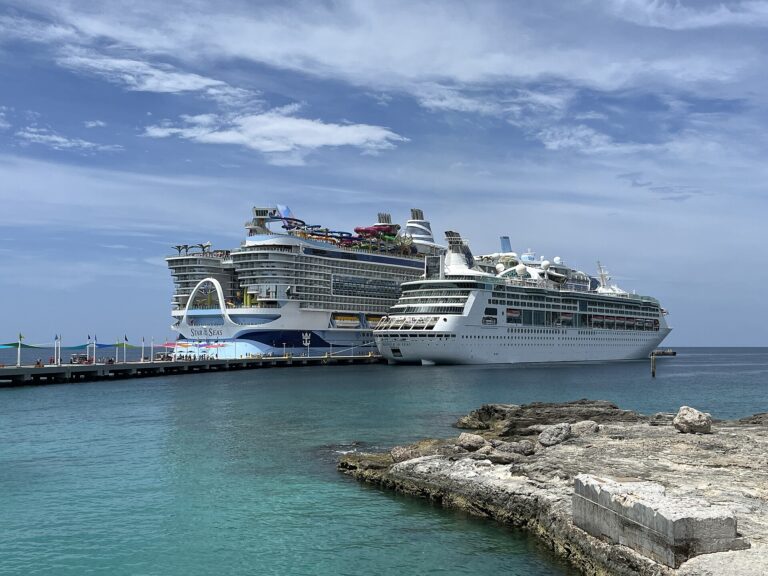 Grandeur of the Seas docked beside Star of the Seas at Perfect Day at CocoCay in the Bahamas with turquoise water