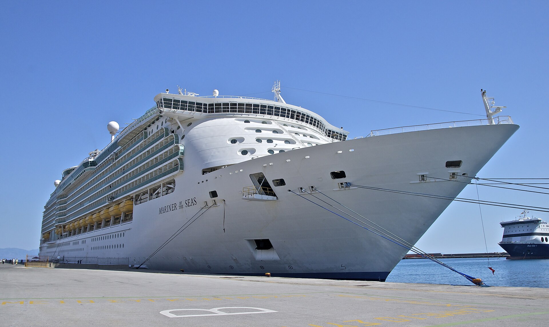 The white bow of Mariner of the Seas moored at Rhodes against a deep blue sky