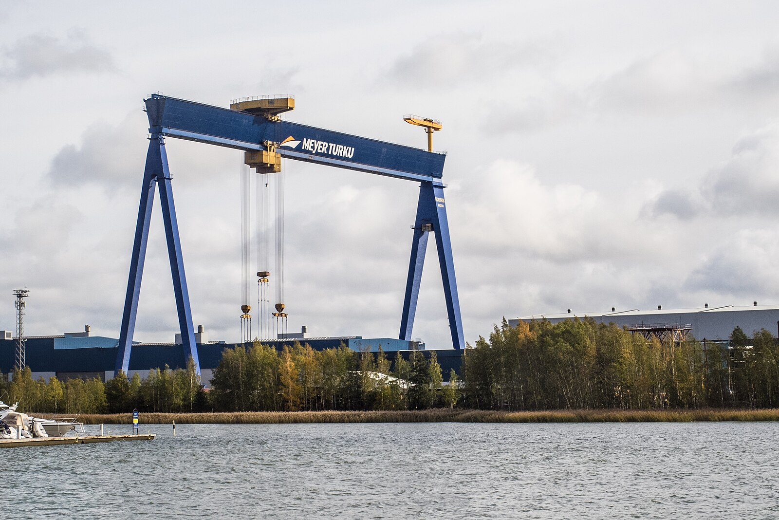 The blue Meyer Turku gantry crane towering over the Perno shipyard in Turku, Finland