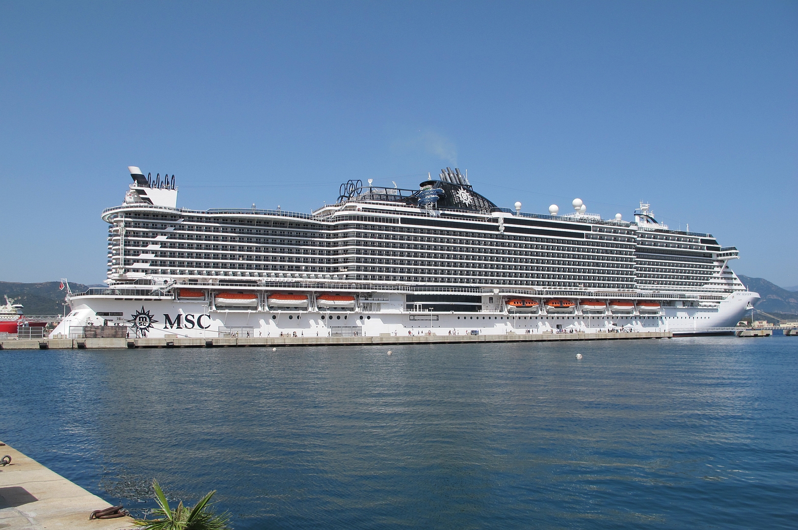 MSC Seaview docked at Ajaccio in bright sunshine on deep blue water