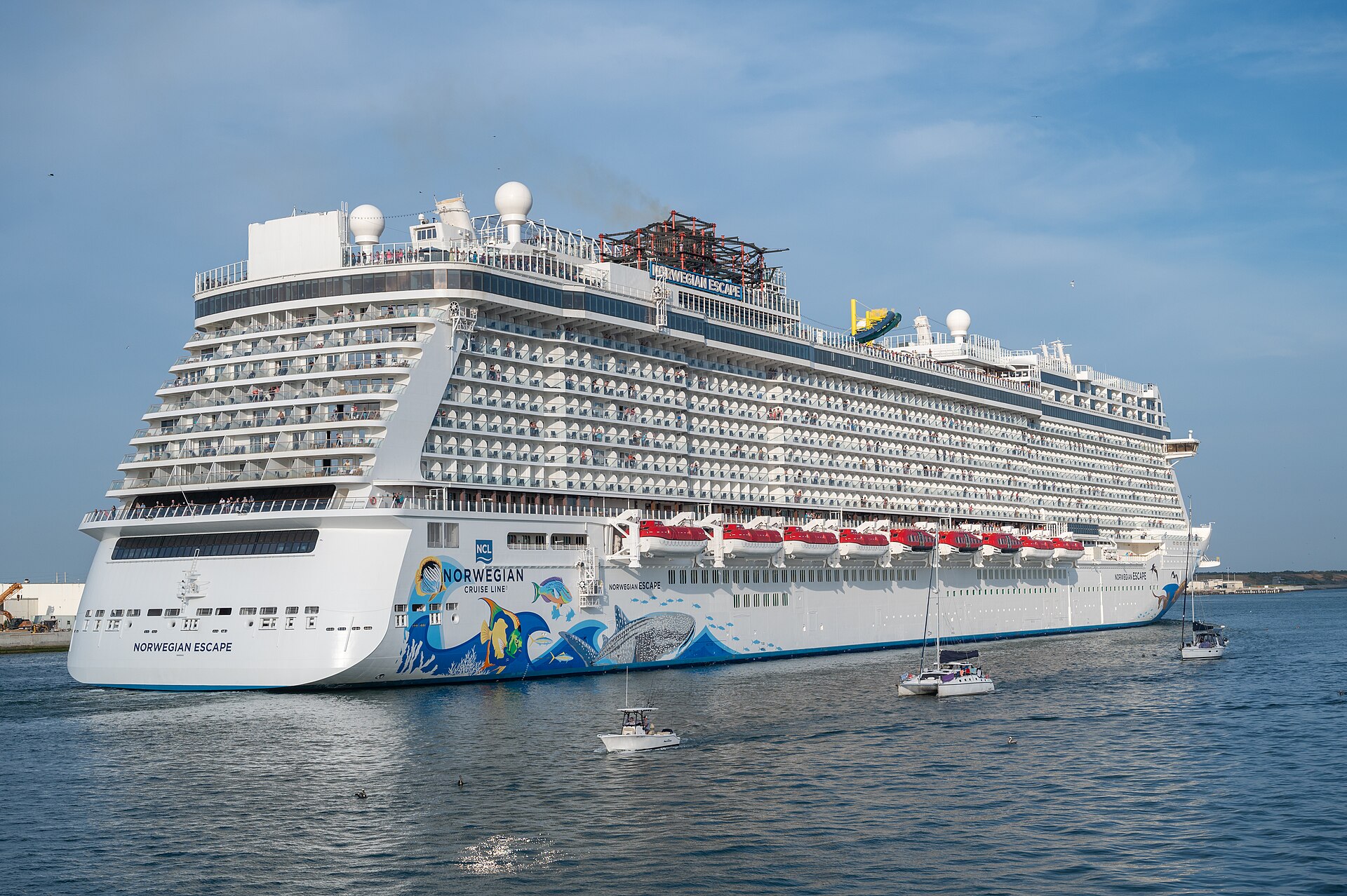 Norwegian Escape cruise ship with its colorful sea-life hull art sailing from Port Canaveral