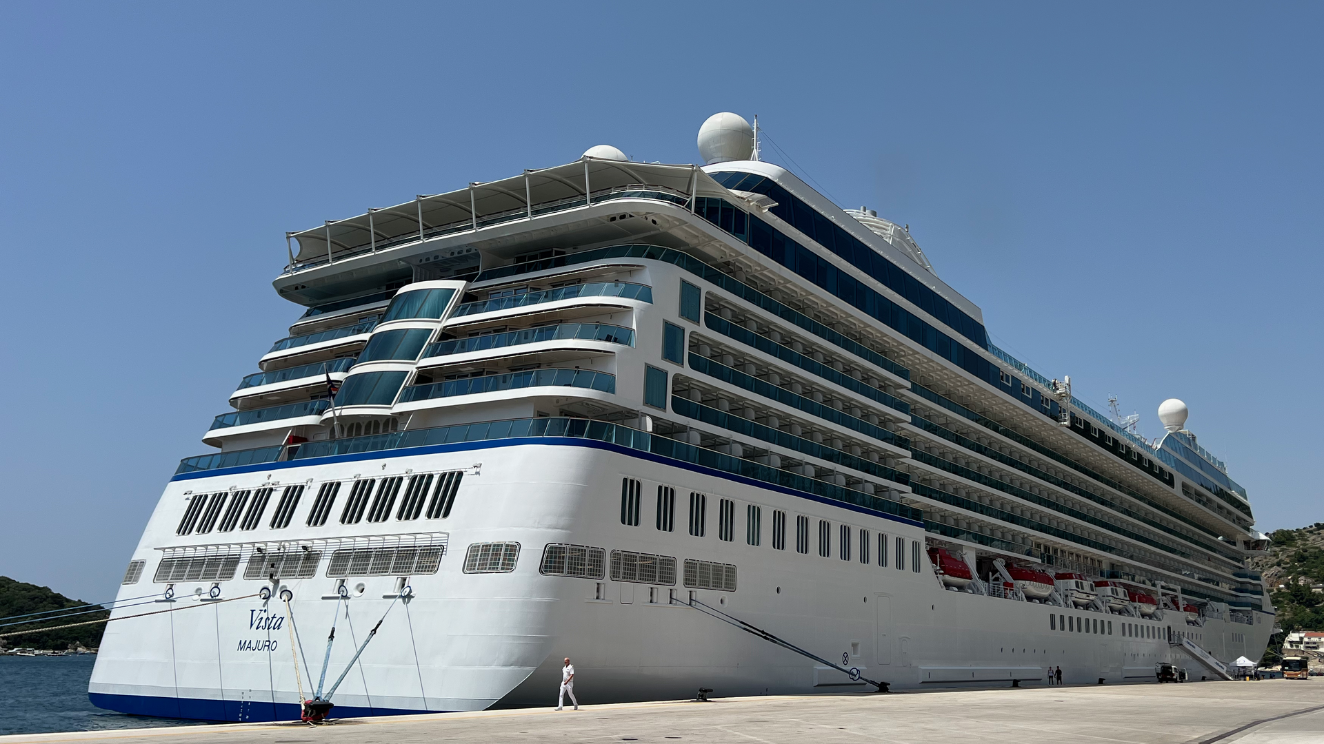 Oceania Cruises ship Vista docked at Dubrovnik, Croatia, under a clear blue sky
