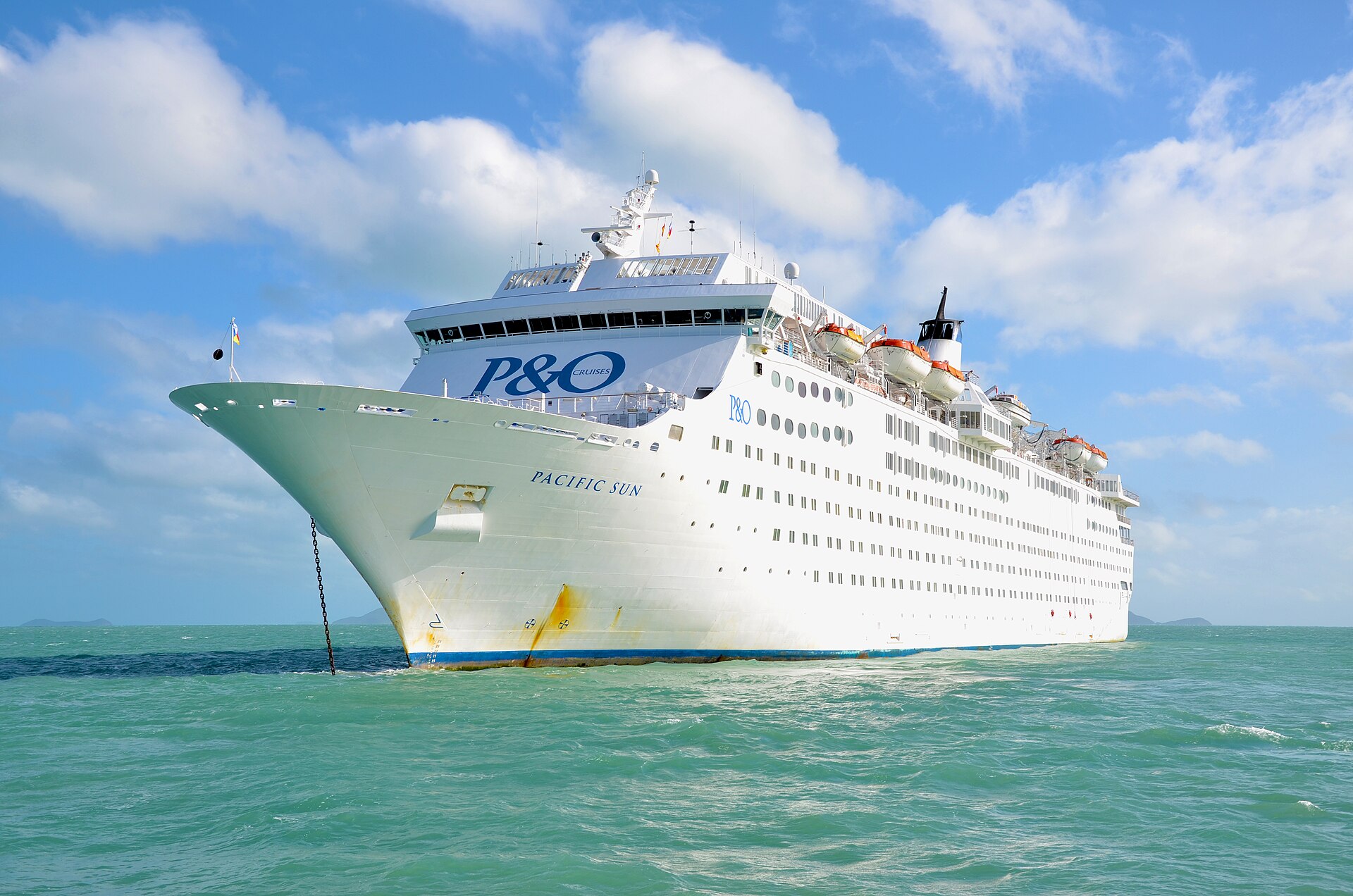 P&O cruise ship Pacific Sun anchored in turquoise water off Airlie Beach in the Whitsunday Islands