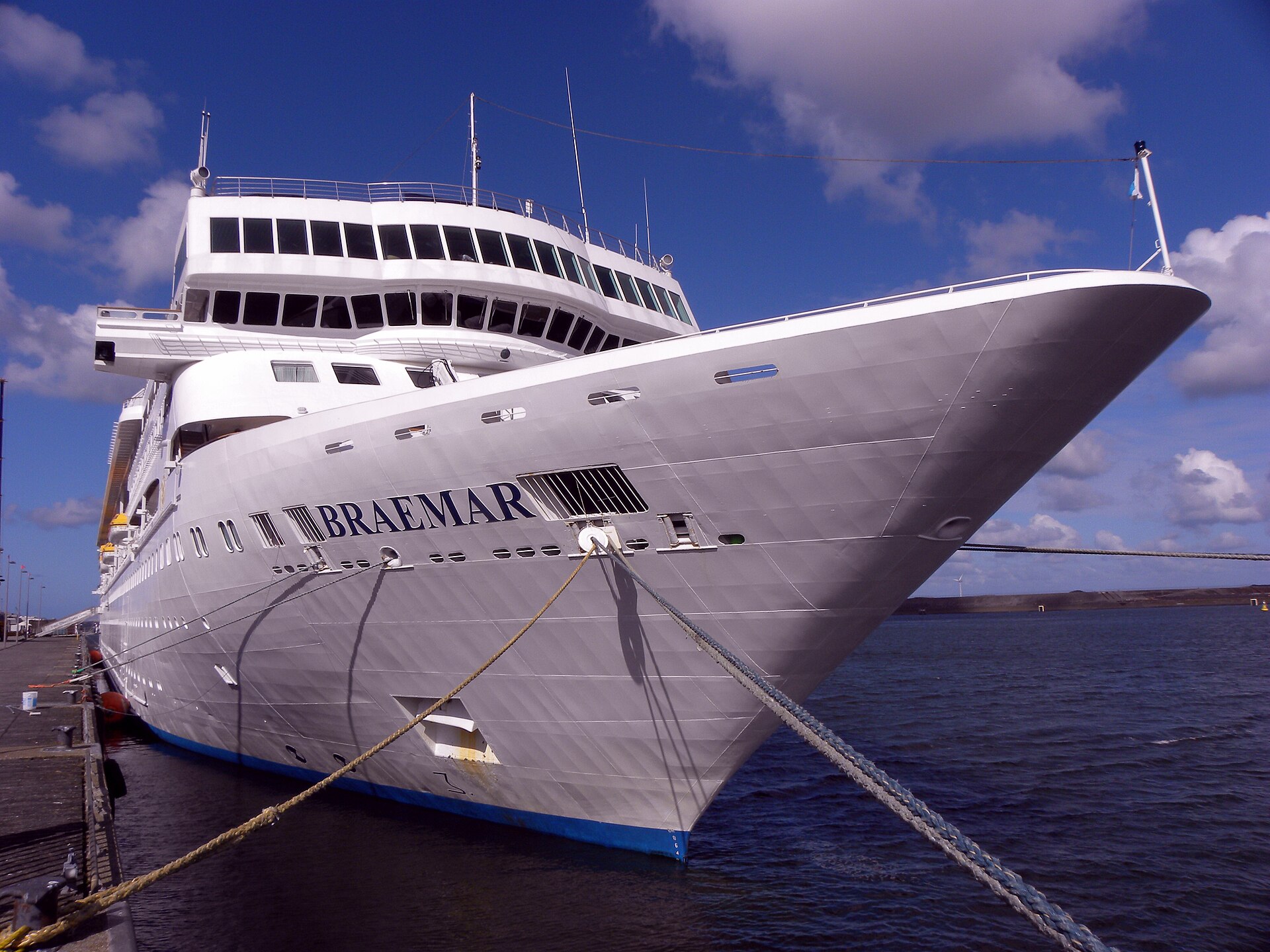 Bow of the cruise ship Braemar tied up with mooring lines in IJmuiden