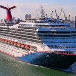 Carnival Freedom sailing out of Port Canaveral with her red, white and blue whale tail funnel, February 2024