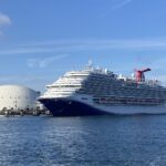 Carnival Panorama docked in Long Beach, California, under a bright blue sky