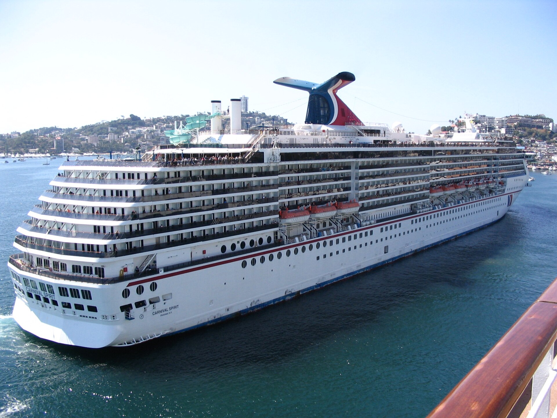 Carnival Spirit docking in the port of Acapulco, Mexico, seen from another ship