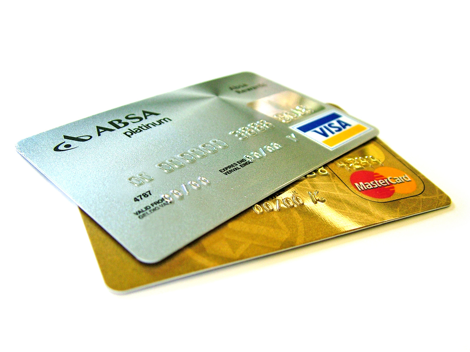 Two credit cards, a silver Visa and a gold Mastercard