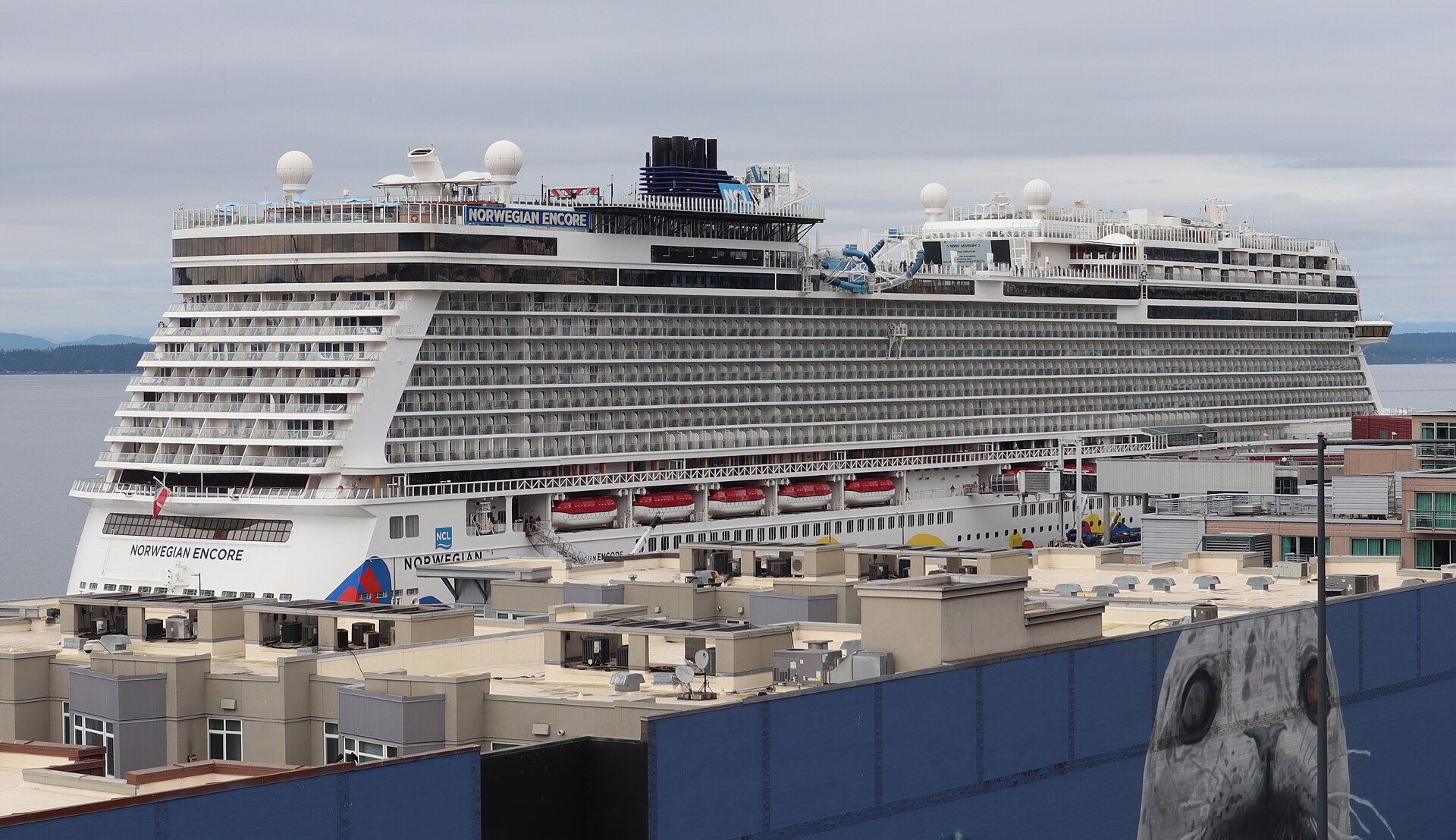 Norwegian Encore docked in Seattle with its colorful hull art visible