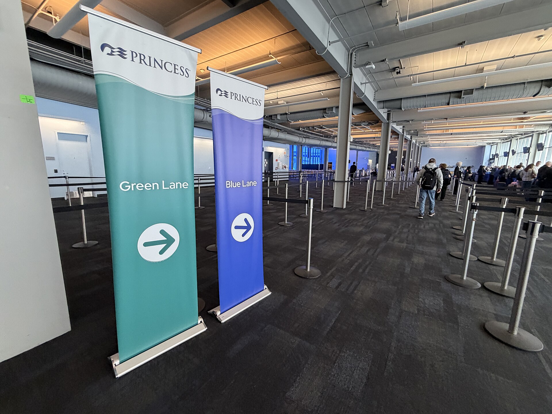Green Lane and Blue Lane check-in banners and queue barriers in the Princess Cruises terminal at Pier 27, San Francisco