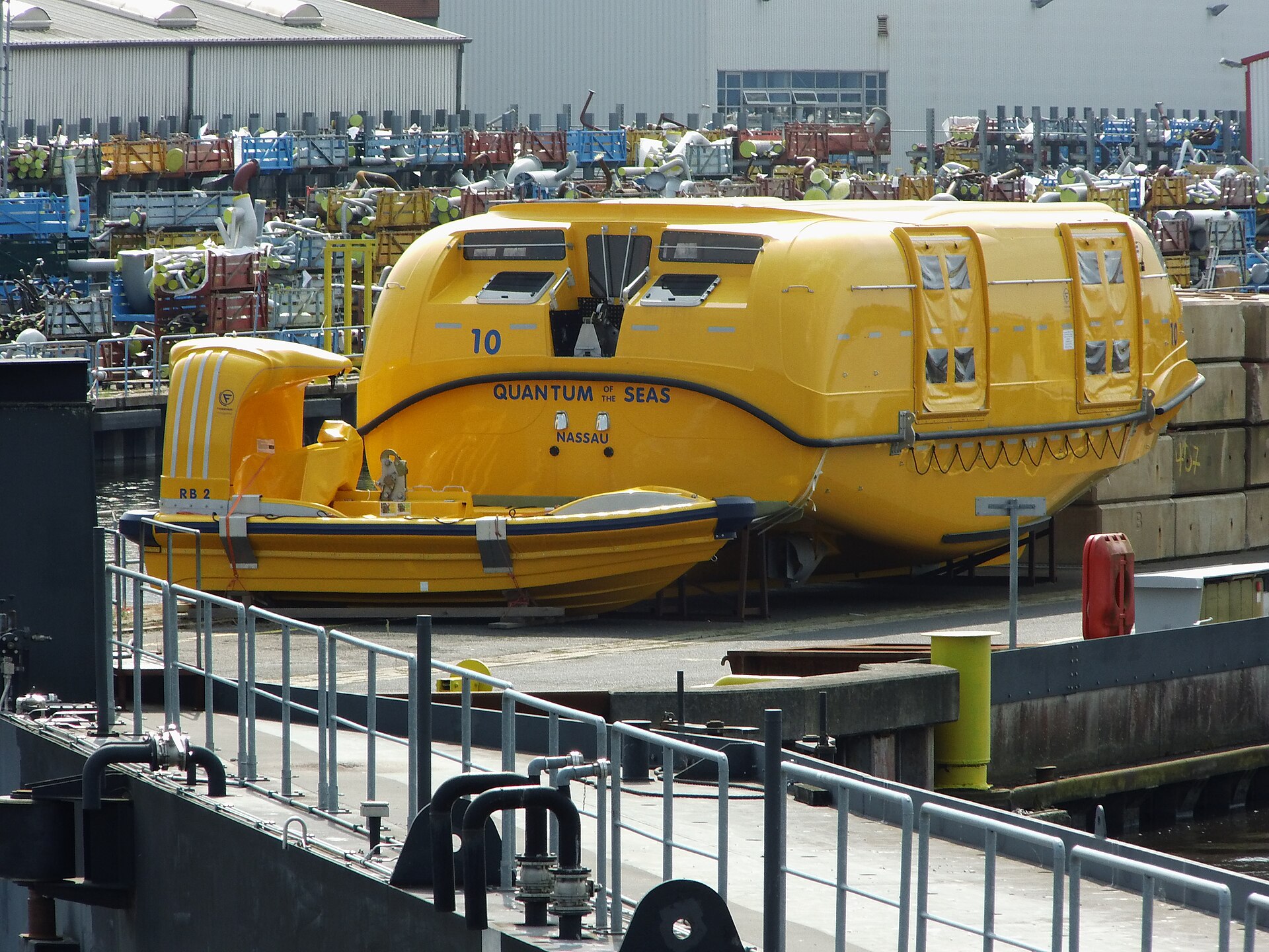 Bright yellow enclosed lifeboat number 10 built for Royal Caribbean's Quantum of the Seas at the Meyer Werft shipyard