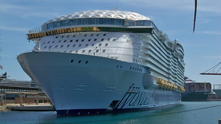 Royal Caribbean's Wonder of the Seas docked in Malaga under a blue sky
