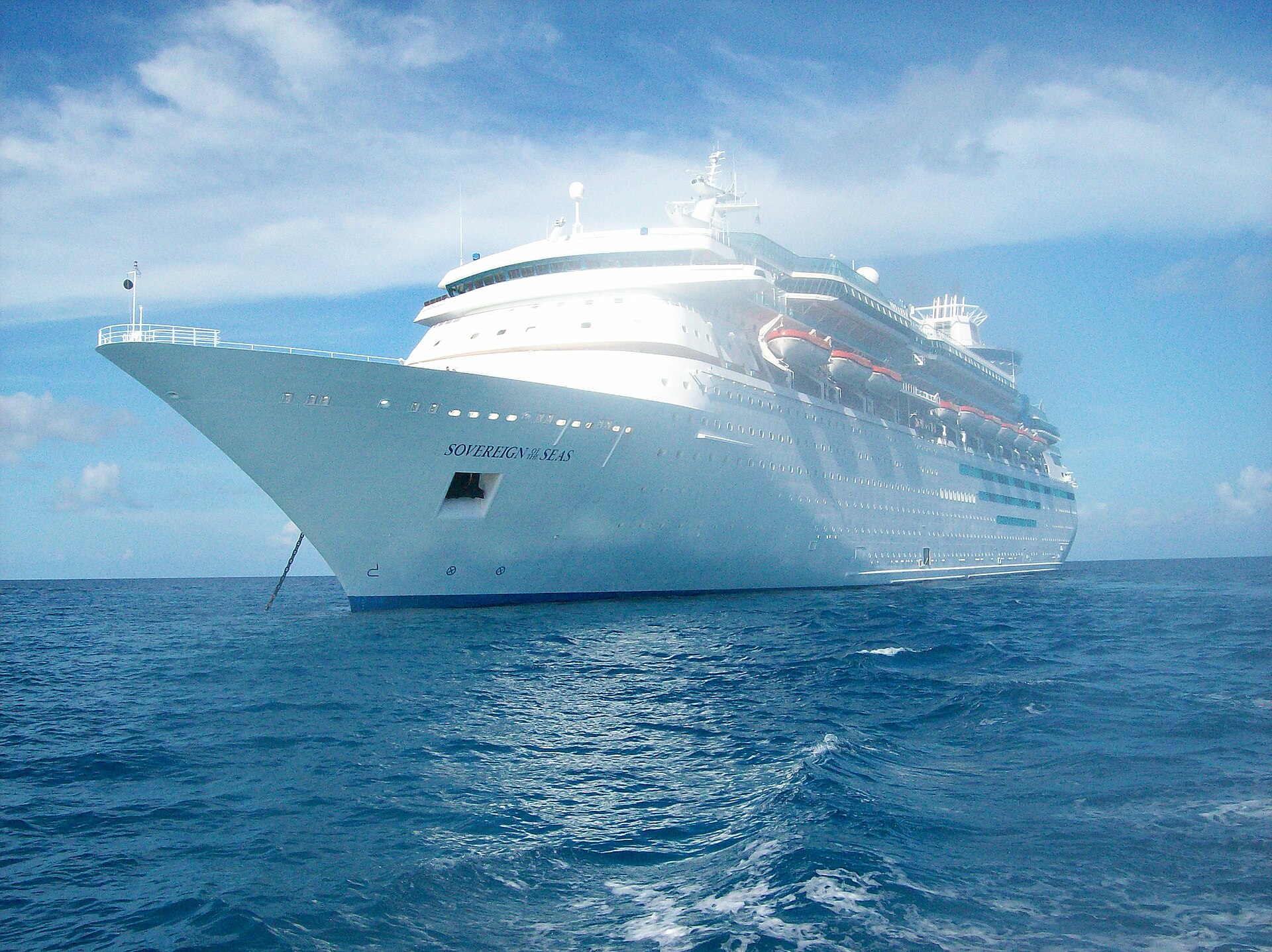 Royal Caribbean's Sovereign of the Seas anchored on deep blue water under a bright sky