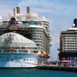 Wonder of the Seas and Celebrity Reflection docked at Perfect Day at CocoCay in turquoise water
